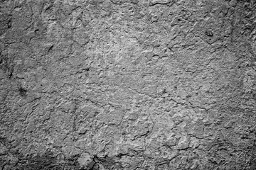 Texture of a concrete wall with cracks and scratches which can be used as a background