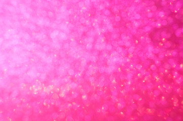 Abstract pink glitter blur background. Defocus dark background for Valentine's day.