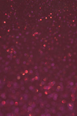 Abstract pink glitter blur background. Defocus dark background for Valentine's day.