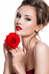 Closeup face of beautiful woman with red rose  bright makeup