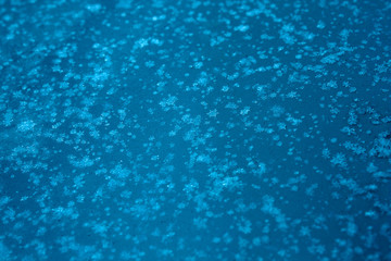 Fototapeta na wymiar background of snowflakes on a blue background