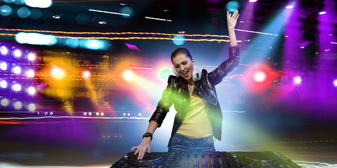 Female dj in nightclub. Mixed media
