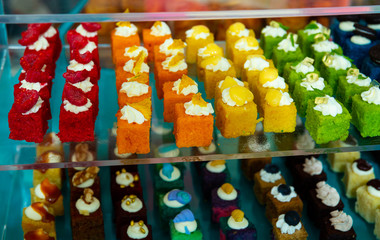 Different delicious cakes in a shop window