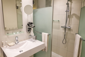 Interior shot of hotel bathroom and wash area