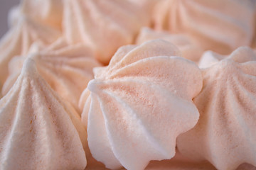 Close up meringue photo. Dessert background. Homemade meringue cookies.
