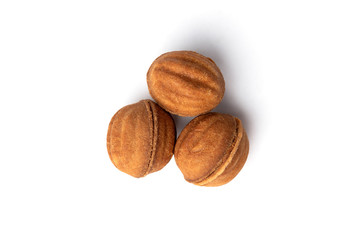 Shortbread in shape nut with caramel isolated on white background.