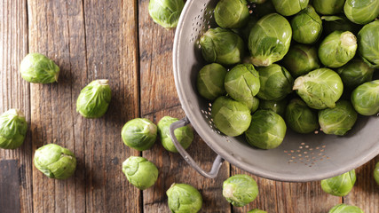 raw brussel sprouts on wood background