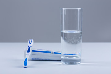 Toothbrush with colored toothpaste, care for the oral cavity and teeth, vector.