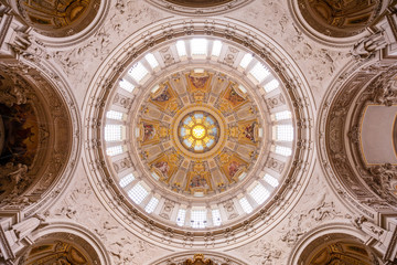Symmetrical view of the frescoed baroque dome of the Berlin cathedral