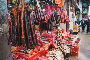 Sausage and meat hanging in traditional butchery street market  in Hong Kong