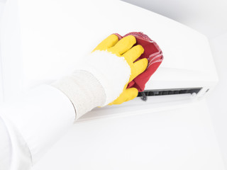 Modern airconditioner unit service - cleaning the housing.