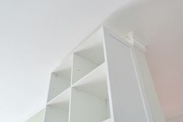 Furniture installation, white cabinet in the interior of the house