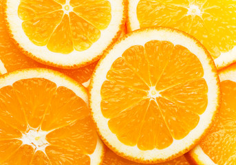 Creative food pattern from round cut slices of ripe juicy oranges. Vitamins healthy lifestyle vegan superfoods concept. Poster banner