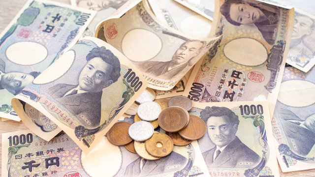 Japanese yen banknotes and Japanese yen coins for background image, vintage tone concept