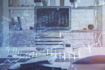 Stock market graph and table with computer background. Multi exposure. Concept of financial analysis.