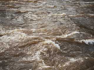Fast river water texture with waves and ripples. Concept power of mother Nature, natural energy.