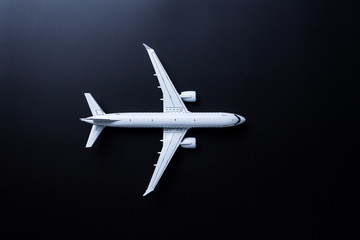 Jet airliner on black background. Plane crash and air incident. The tragedy, deaths, victims and...