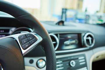 Control buttons on the steering wheel of a car