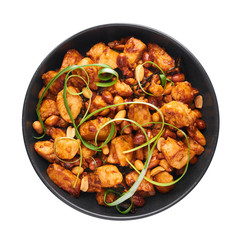 Kung Pao Chicken or Gong Bao Ji Ding isolated on white background. Sichuan Kung Pao is chinese cuisine dish with chicken meat, chilli peppers, peanuts, sauces and onion. Top view