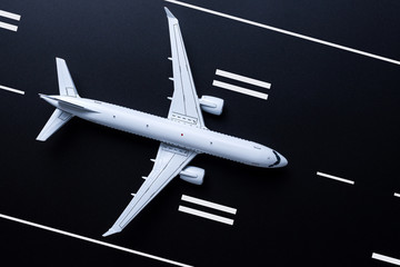 Jet airliner on black runway background. Travel and aero space industry concept, booking summer vacation