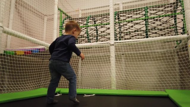 European Two Year Old Caucasian Boy Playing At Playground.