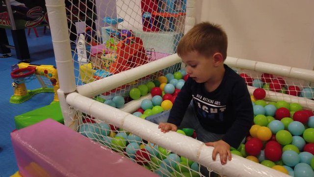 European two year old Caucasian boy playing at playground.
