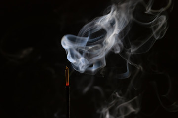 abstract background of smoke from incense stick close up with copy of space on black background