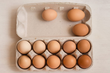 Beige chicken eggs in a carton. Vegetarian natural eco products. Food Gradient