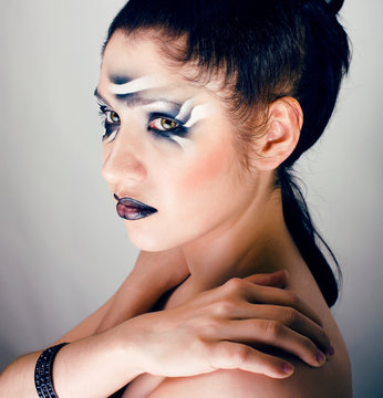 beauty young woman with creative make up like zebra closeup, waves on face