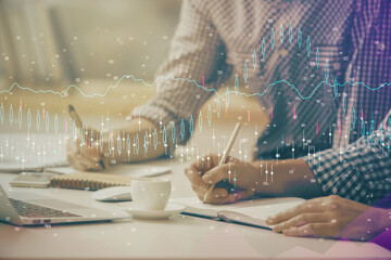 Multi exposure of forex chart with man working on computer on background. Concept of market analysis.