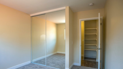 Panorama frame Empty bedroom with mirror closet doors