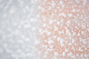 Fluffy snow flakes on the window, closeup