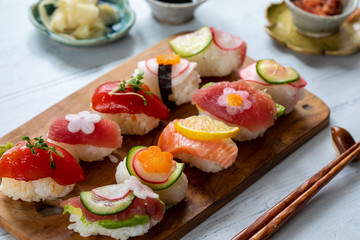 Nigiri sushi with salmon, tuna and vegetables