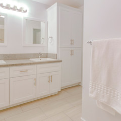 Fototapeta na wymiar Square Bright white bathroom with white towel