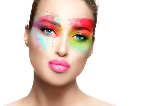 Beauty model with colorful fashion art makeup pouting lips
