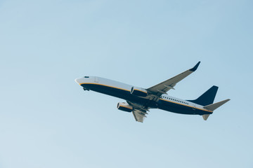 Fototapeta na wymiar Commercial jet liner taking off in blue sky