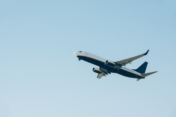 Low angle view of airplane departure in clear sky