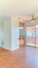 Vertical Living room in townhome with closed kitchen