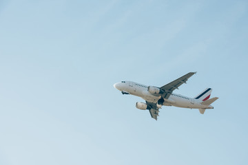 Fototapeta na wymiar Low angle view of flight departure of airplane in clear sky