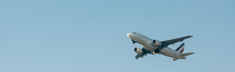 Flight departure of airplane in blue sky with copy space, panoramic shot