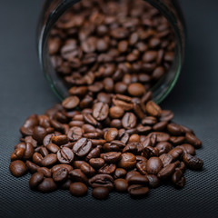 Coffee beans and pot in dark background