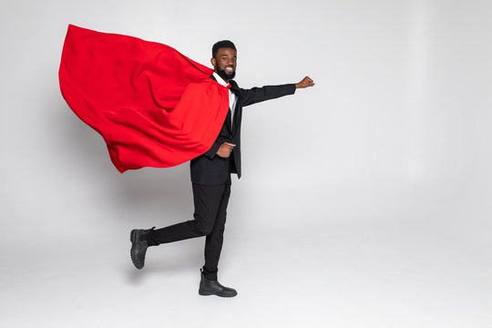Young african businessman hero run with fist up isolated on white background