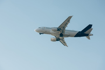 Flight departure of commercial plane in blue sky