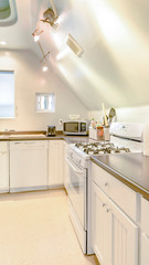 Vertical Bright, open and warm kitchen with vaulted ceilings and stove top