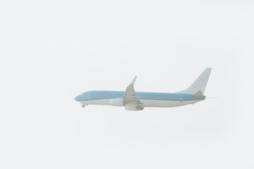Jet plane landing with cloudy sky at background