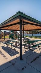 Vertical Outdoors covered tables and benches for a picnic