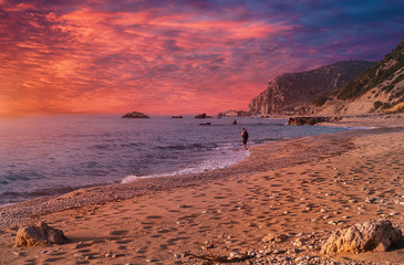 Fantastic colorful spring sunset view of Avali Beach. Picturesque evening seascape of Ionian sea. Lefkada Island, Greece, Europe. Awesome nature landscape with colorful sky during sunset.