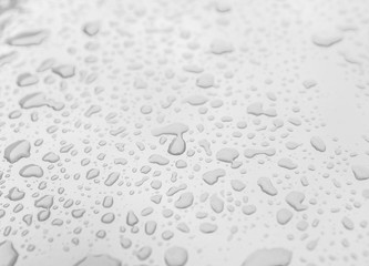 Rain drops on a red surface