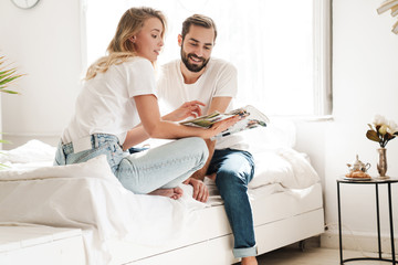 Happy young couple in love relaxing on a couch