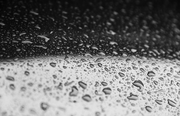 Rain drops on a red surface